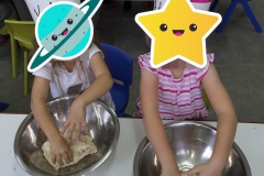 Children kneading the dough!